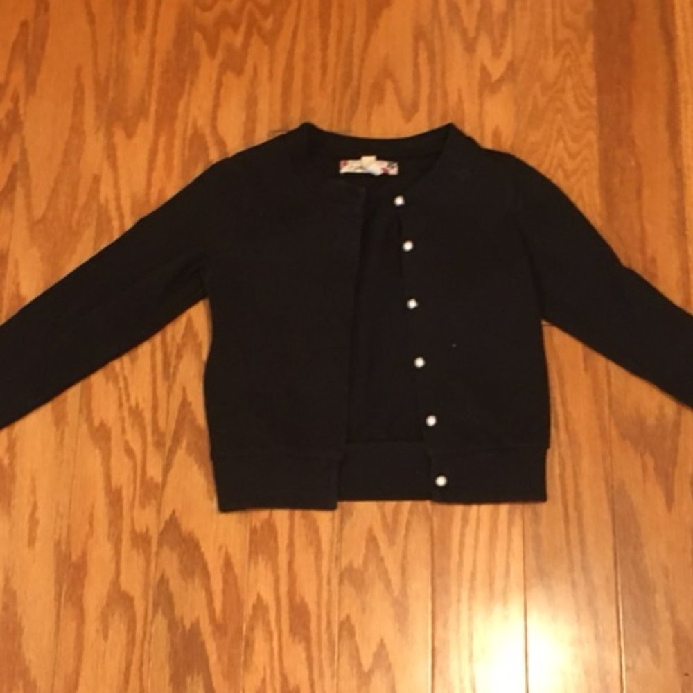 black cardagin with pearl buttons